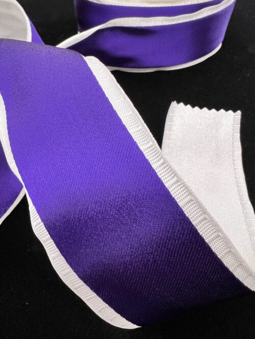 Satin Finished Woven Purple Ribbon with White Backing.